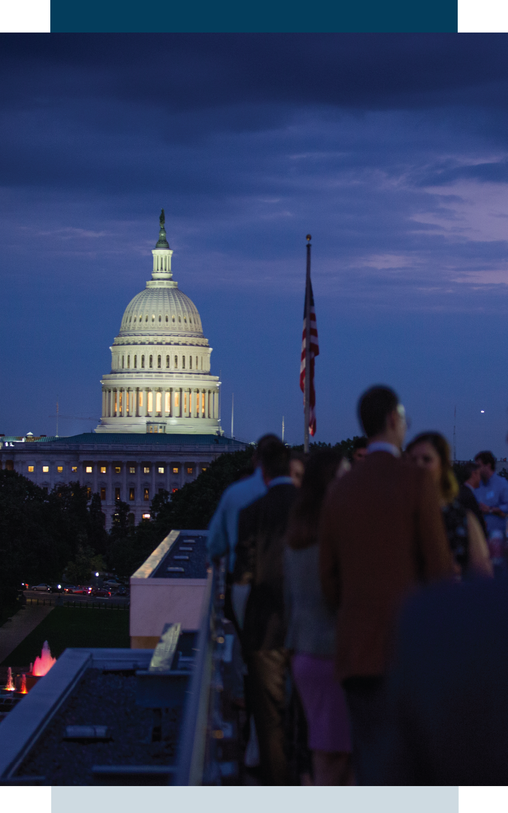 US Capitol with sunset and networking crowd and US flag in distance