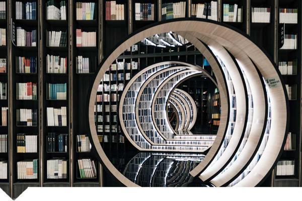 Book shelves with spiral shape in foreground